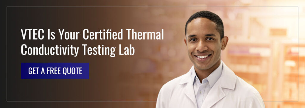 A man in a lab code smiling at the camera